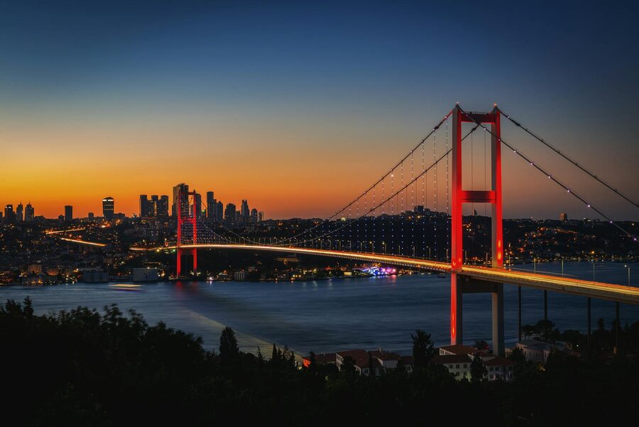 The Bosphorus Bridge lit at dusk over the strait