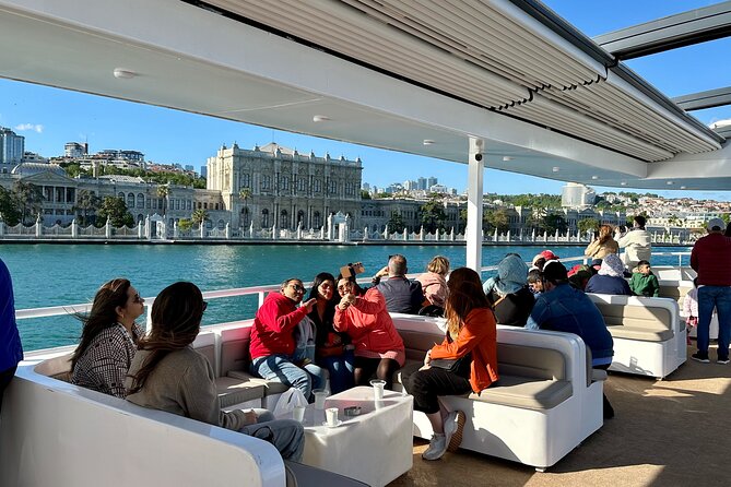 Bosphorus Daytime or Sunset Sightseeing Cruise & Audio Guide - Dolmabahçe Mosque: Ottoman Minarets Right Beside the Palace View